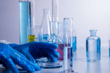 Hand of a scientist taking samples with a pipetteの写真素材