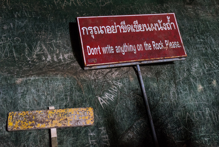 don't write anything on rock sign, next to text written on the rockの写真素材