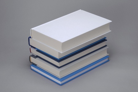 A buncj of 5 books with white plain on the topの写真素材