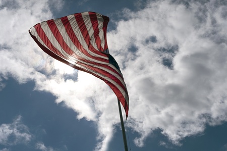 Cloudy sky and American Flag