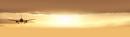 Two jet engine aircraft in sunsetの写真素材