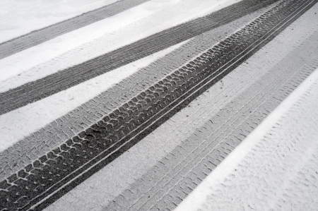 Winter tire marks in the snowの写真素材