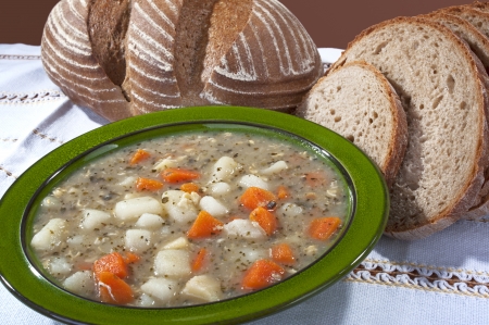 Soup - homemade potato soup with carrot and breadの写真素材