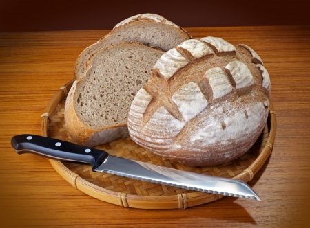 Bread with knife - sliced bakery breadの写真素材