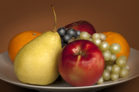 Fruit - still life with apple, orange, vine and pearの写真素材