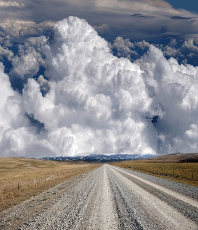 Road and clouds in Alberta, Canadaの写真素材