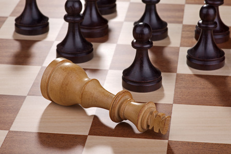 Chess - dead white king with black pawnsの写真素材