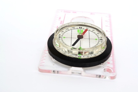 Detail shot of a glass compass on white background