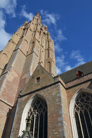 Tower of the Church of Our Lady in Bruges, Belgium - the tallest structure in the city and the second tallese brickwork tower in the worldの写真素材