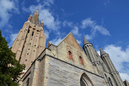 Tower of the Church of Our Lady in Bruges, Belgium - the tallest structure in the city and the second tallese brickwork tower in the worldの写真素材