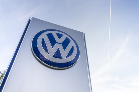 PRAGUE, CZECH REPUBLIC - SEPTEMBER 5: Volkswagen carmaker logo on a building of dealership on September 24, 2015 in Prague, Czech republic. Great emission scandal raises around number of Volkswagen Group cars with the EA189, 2.0 litre TDI engine.のeditorial素材
