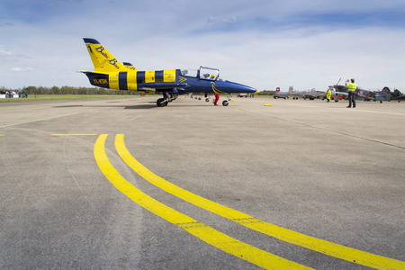 HRADEC KRALOVE, CZECH REPUBLIC - SEPTEMBER 5: Baltic Bees Jet Team with Aero L-39 Albatros planes standing on a runway at the CIAF - Czech international air fest on September 5, 2015 in Hradec Kralove, Czech republic.のeditorial素材