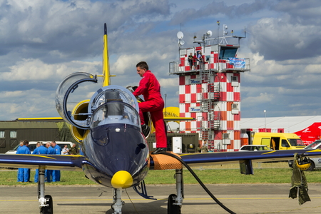 HRADEC KRALOVE, CZECH REPUBLIC - SEPTEMBER 5: Crew of the Baltic Bees Jet Team with L-39 Albatros planes standing on runway at Czech international air festival on September 5, 2015 in Hradec Kralove, Czech republic.のeditorial素材