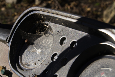 Rusty speedometer on the vintage car control panel in sunny dayの写真素材