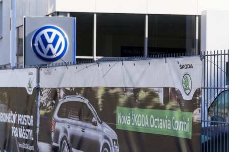 PRAGUE, CZECH REPUBLIC - OCTOBER 1: Volkswagen and Skoda car maker logo on a building of dealership on October 1, 2015 in Prague, Czech republic.のeditorial素材
