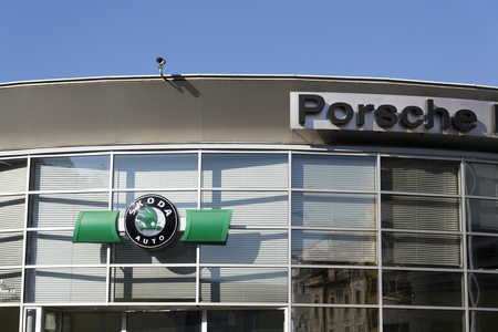 PRAGUE, CZECH REPUBLIC - OCTOBER 1: Porsche and Skoda auto car maker logo on a building of dealership on October 1, 2015 in Prague, Czech republic.のeditorial素材