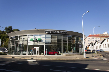 PRAGUE, CZECH REPUBLIC - OCTOBER 1: Porsche and Skoda auto car maker logo on a building of dealership on October 1, 2015 in Prague, Czech republic.のeditorial素材