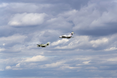 HRADEC KRALOVE, CZECH REPUBLIC - SEPTEMBER 5: German jet fighter aircraft Messerschmitt Me-262 Schwalbe and soviet Mikoyan-Gurevich MiG-15 flying on September 5, 2015 in Hradec Kralove, Czech republic.のeditorial素材