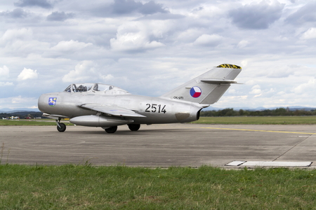 HRADEC KRALOVE, CZECH REPUBLIC - SEPTEMBER 5: Jet fighter aircraft Mikoyan-Gurevich MiG-15 developed for the Soviet Union rolling on runway on September 5, 2015 in Hradec Kralove, Czech republic.のeditorial素材