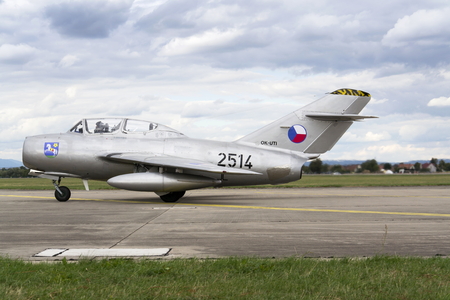 HRADEC KRALOVE, CZECH REPUBLIC - SEPTEMBER 5: Jet fighter aircraft Mikoyan-Gurevich MiG-15 developed for the Soviet Union rolling on runway on September 5, 2015 in Hradec Kralove, Czech republic.のeditorial素材