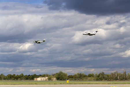 HRADEC KRALOVE, CZECH REPUBLIC - SEPTEMBER 5: German jet fighter aircraft Messerschmitt Me-262 Schwalbe and soviet Mikoyan-Gurevich MiG-15 flying on September 5, 2015 in Hradec Kralove, Czech republic.のeditorial素材