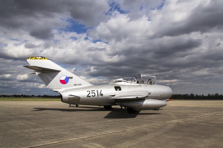 HRADEC KRALOVE, CZECH REPUBLIC - SEPTEMBER 5: Jet fighter aircraft Mikoyan-Gurevich MiG-15 developed for the Soviet Union standing on runway on September 5, 2015 in Hradec Kralove, Czech republic.のeditorial素材