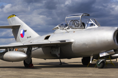 HRADEC KRALOVE, CZECH REPUBLIC - SEPTEMBER 5: Jet fighter aircraft Mikoyan-Gurevich MiG-15 developed for the Soviet Union standing on runway on September 5, 2015 in Hradec Kralove, Czech republic.のeditorial素材