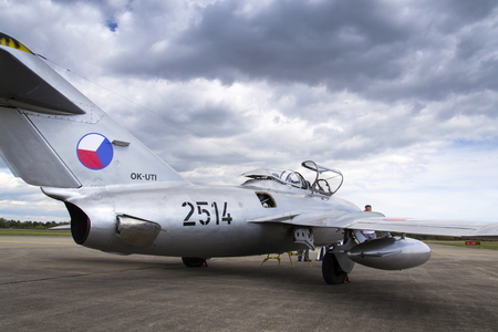 HRADEC KRALOVE, CZECH REPUBLIC - SEPTEMBER 5: Jet fighter aircraft Mikoyan-Gurevich MiG-15 developed for the Soviet Union standing on runway on September 5, 2015 in Hradec Kralove, Czech republic.のeditorial素材