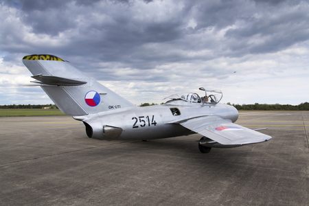 HRADEC KRALOVE, CZECH REPUBLIC - SEPTEMBER 5: Jet fighter aircraft Mikoyan-Gurevich MiG-15 developed for the Soviet Union standing on runway on September 5, 2015 in Hradec Kralove, Czech republic.のeditorial素材