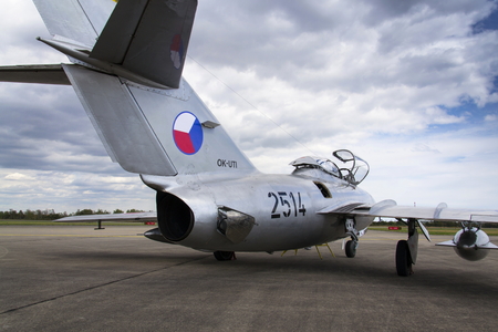 HRADEC KRALOVE, CZECH REPUBLIC - SEPTEMBER 5: Jet fighter aircraft Mikoyan-Gurevich MiG-15 developed for the Soviet Union standing on runway on September 5, 2015 in Hradec Kralove, Czech republic.のeditorial素材