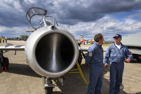 HRADEC KRALOVE, CZECH REPUBLIC - SEPTEMBER 5: Pilot of jet fighter aircraft Mikoyan-Gurevich MiG-15 developed for the Soviet Union standing on runway on September 5, 2015 in Hradec Kralove, Czech republic.のeditorial素材
