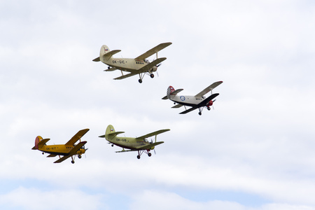 HRADEC KRALOVE, CZECH REPUBLIC - SEPTEMBER 5: Group of Antonov An-2 biplanes flying on September 5, 2015 in Hradec Kralove, Czech republic.のeditorial素材