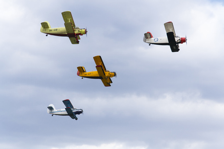 HRADEC KRALOVE, CZECH REPUBLIC - SEPTEMBER 5: Group of Antonov An-2 biplanes flying on September 5, 2015 in Hradec Kralove, Czech republic.のeditorial素材