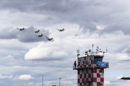 HRADEC KRALOVE, CZECH REPUBLIC - SEPTEMBER 5: Group of Antonov An-2 biplanes flying on September 5, 2015 in Hradec Kralove, Czech republic.のeditorial素材