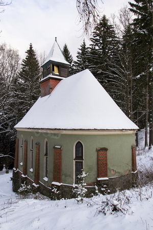 Church of the Saint Joseph in wood in frosty mountains country winter eveningの写真素材