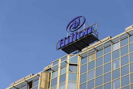 PRAGUE, CZECH REPUBLIC - MARCH 31: Hilton hotels and resorts logo on the building of Hilton Prague hotel on March 31, 2016 in Prague, Czech republic.のeditorial素材