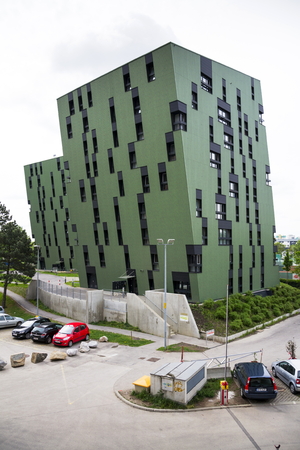 VIENNA, AUSTRIA - MAY 7: Modern residential apartments living house exterior near Gasometers of Vienna on 7 May 2012 in Vienna, Austria.のeditorial素材