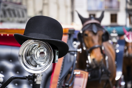 Horse carriage in Vienna, Austria with bowler on the lightの写真素材