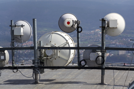 Bunch of transmitters and aerials on the telecommunication tower
