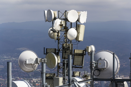 Bunch of transmitters and aerials on the telecommunication towerの写真素材