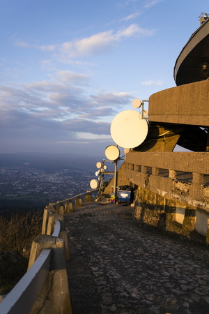 Transmitters and aerials on telecommunication tower during sunsetの写真素材
