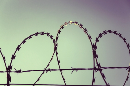 Filtered vintage picture of barbed wire fence detailの写真素材