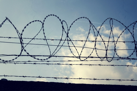 Filtered vintage picture of barbed wire fence detailの写真素材