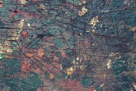 Colorful filtered old wood texture background splashed with colorsの写真素材