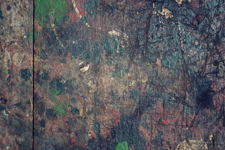 Colorful filtered old wood texture background splashed with colorsの写真素材