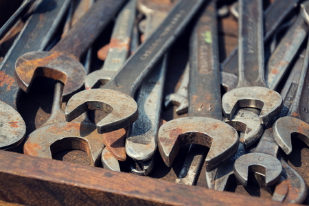 Loads of wrenches or spanners in a wooden drawerの写真素材