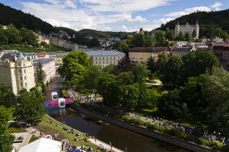 KARLOVY VARY, CZECH REPUBLIC - JULY 3: People walk on streets during Karlovy Vary international film festival on July 3, 2016 in Karlovy Vary, Czech republic.のeditorial素材