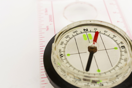 Detail shot of a glass compass on white backgroundの写真素材