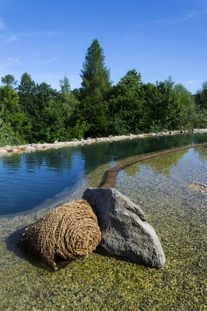 Textile fabric net in natural swimming pond for purifying plantsの写真素材