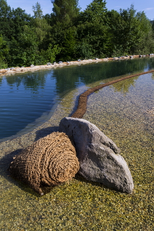 Textile fabric net in natural swimming pond for purifying plantsの写真素材